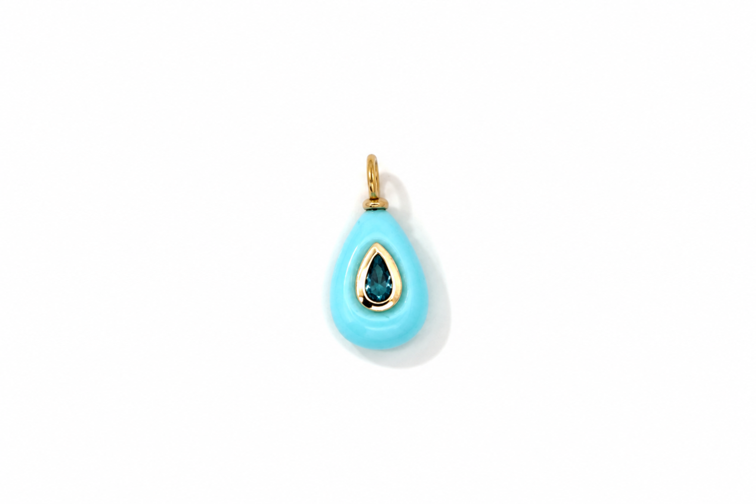 Fleurette Turquoise Charm Gold featuring a carved turquoise-coloured gemstone with a blue crystal on a waterproof 14k gold PVD loop.