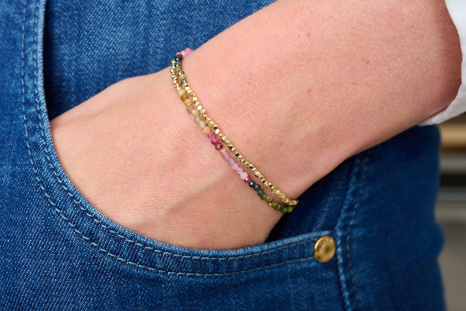 Juniper Gold & Tourmaline Double Strand Bracelet featured on wrist with Boho Betty stacking bracelets in gold and colourful gemstone tones.