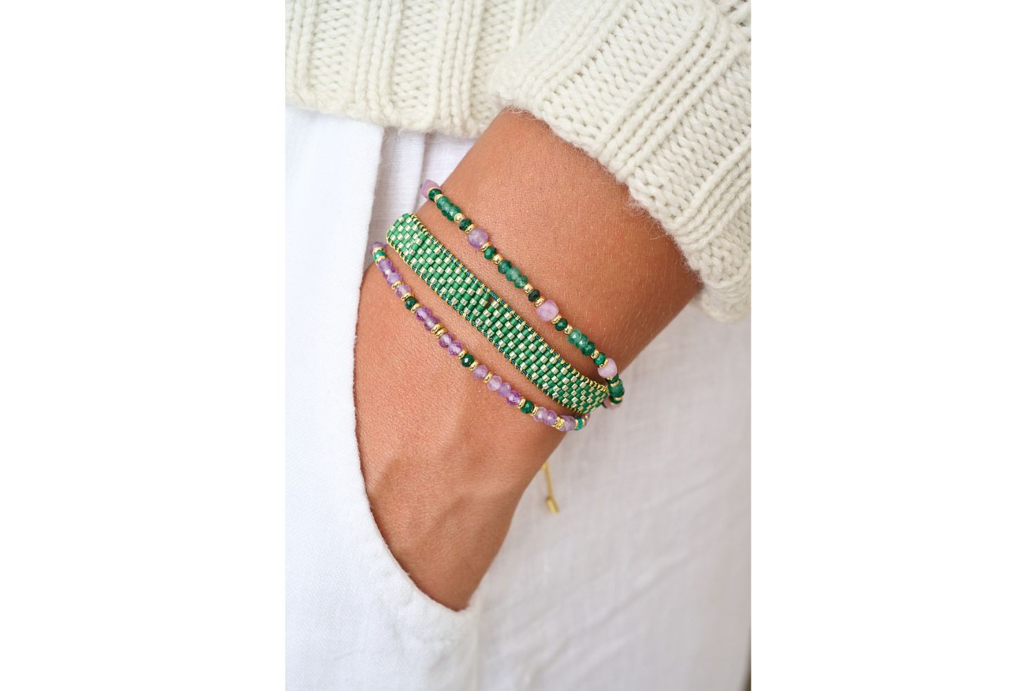 Amina amethyst and malachite February birthstone bracelet featured on wrist with Boho Betty stacking bracelets.