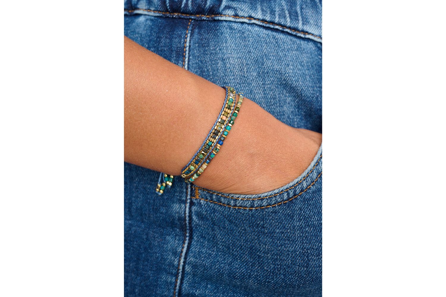 Anastasia Gold & Azurite Gemstone Friendship Bracelet styled on the wrist, showcasing its deep blue hues, golden accents, and effortlessly chic boho-luxe design.