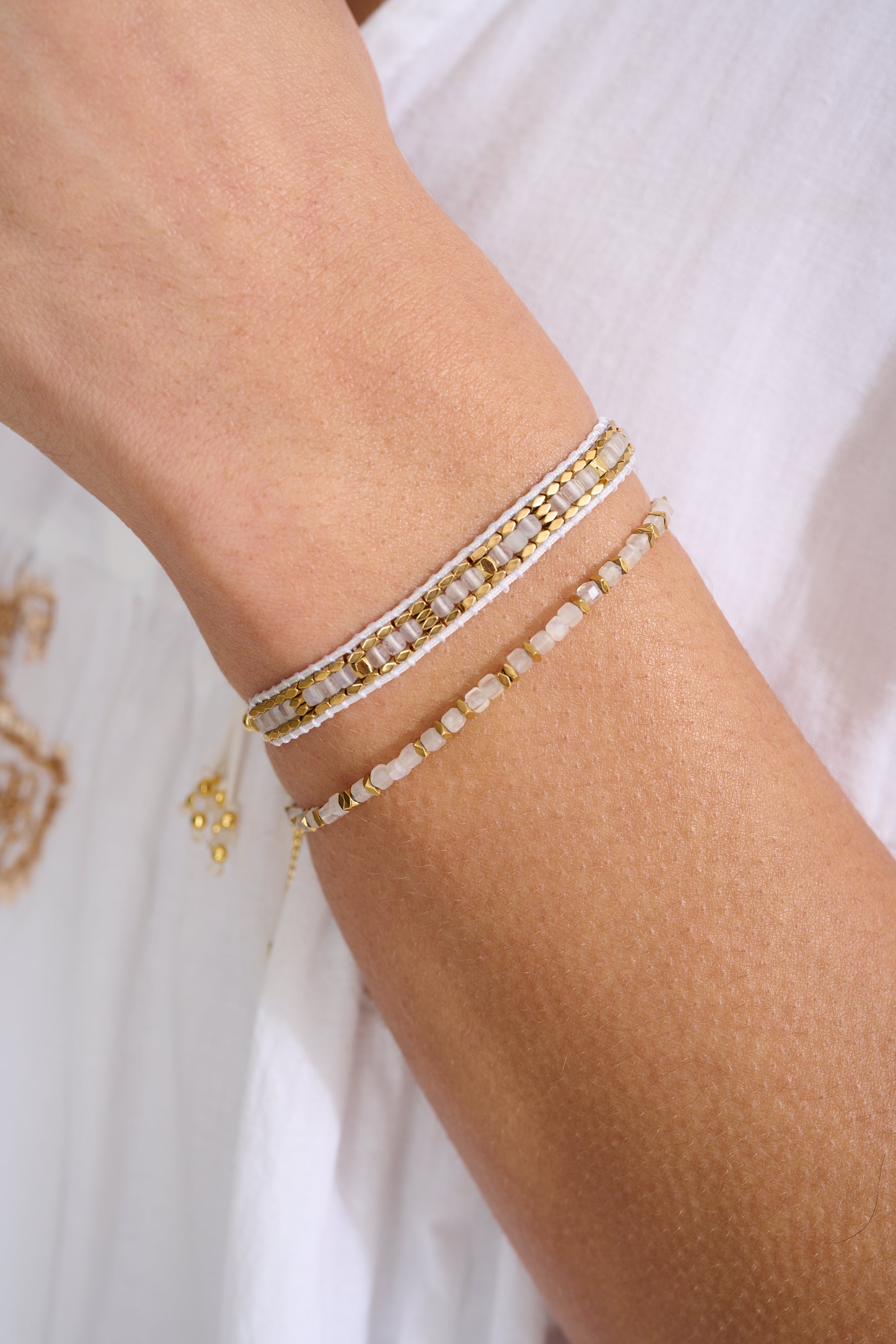 Anastasia Gold & Rainbow Moonstone Beaded Bracelet styled for boho-chic layering, highlighting iridescent moonstone beads paired with gold-plated accents—perfect for cosmic musings and mindful moments.