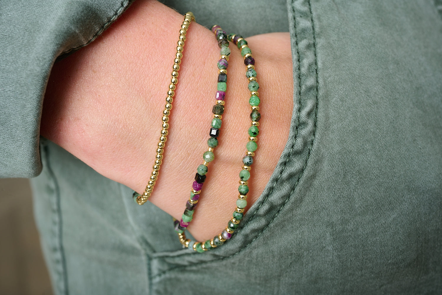 Annabelle Wrap Bracelet styled on wrist with vibrant gemstone stacks, green tones, and golden accessories for a joyful, boho-inspired look.
