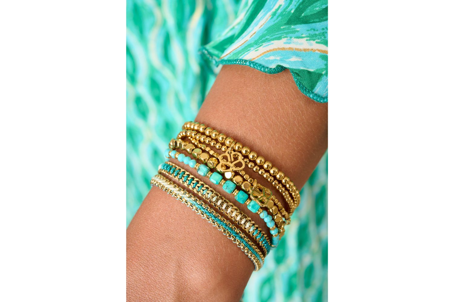 Bahari Turquoise & Gold Bracelet Stack styled on wrist with layered Boho Betty coastal gold and turquoise bracelets