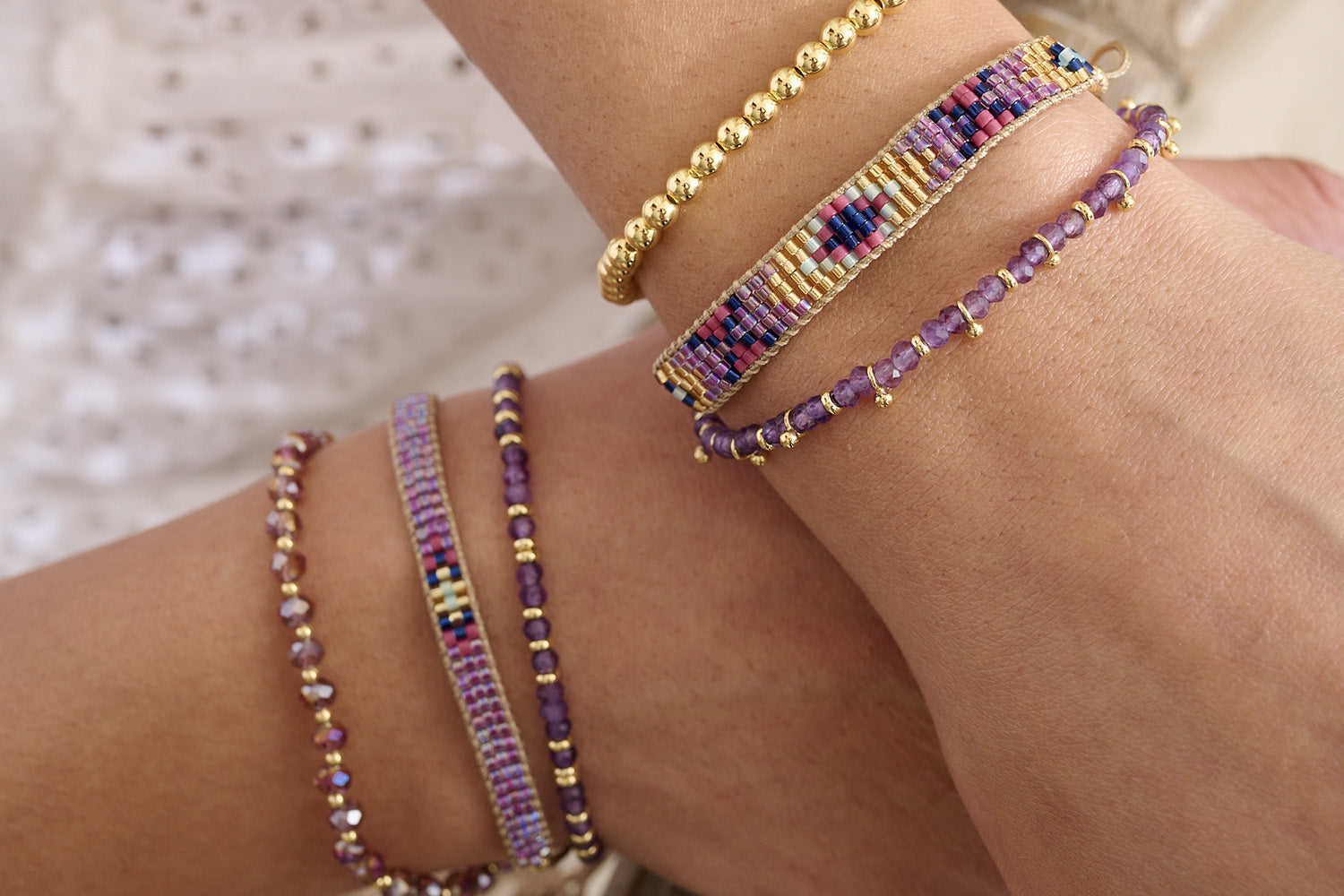Bali Amethyst & Gold Bracelet Stack styled with vibrant purple tones and golden accents, perfect for gifting or glowing up your everyday look.