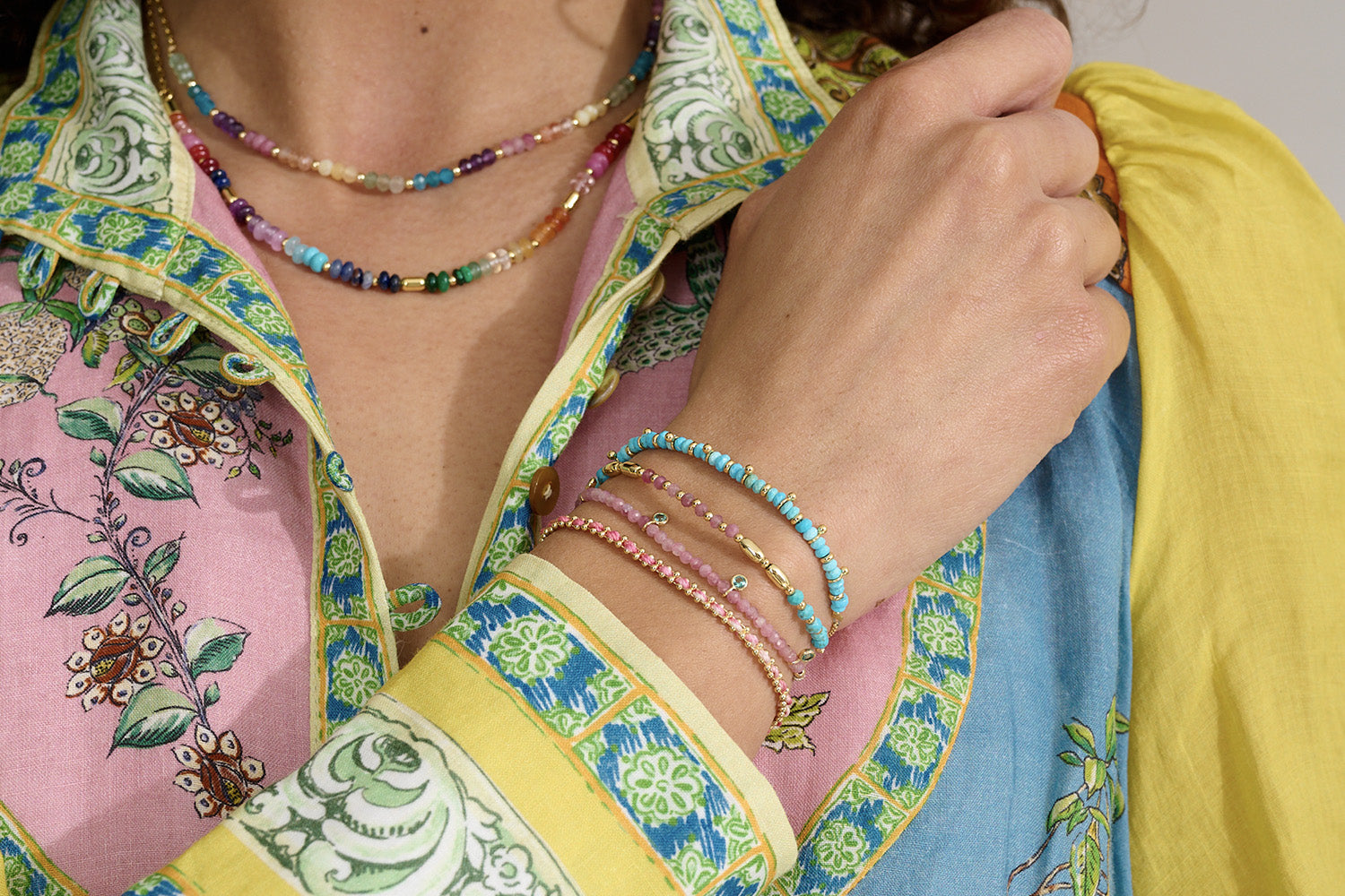 Bisbee Gold, Pink Tourmaline & Turquoise Bracelet styled for boho-inspired stacking, showcasing vibrant gemstone beads and gold-plated accents—perfect for layering or wearing solo as a bold, colourful statement.