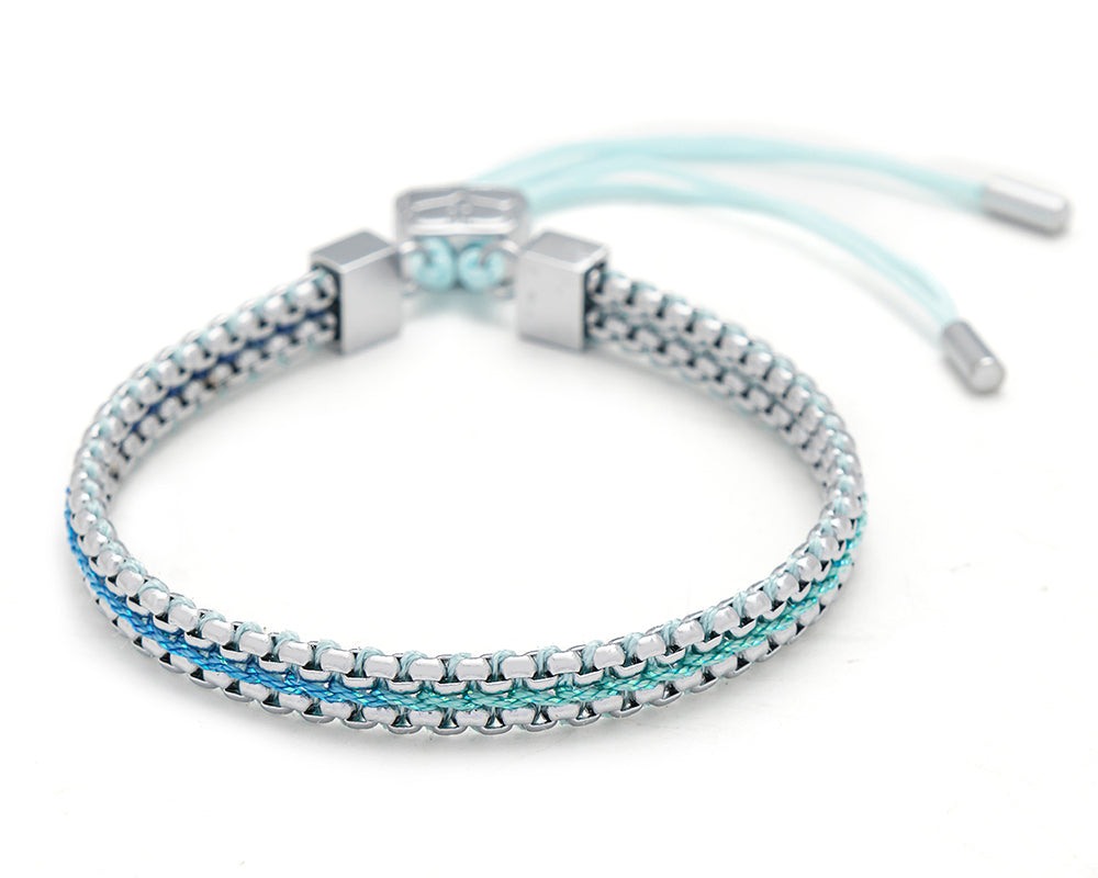 Bloom sky blue braided friendship bracelet with soft blue threads and silver chain detailing with adjustable slider fastening.