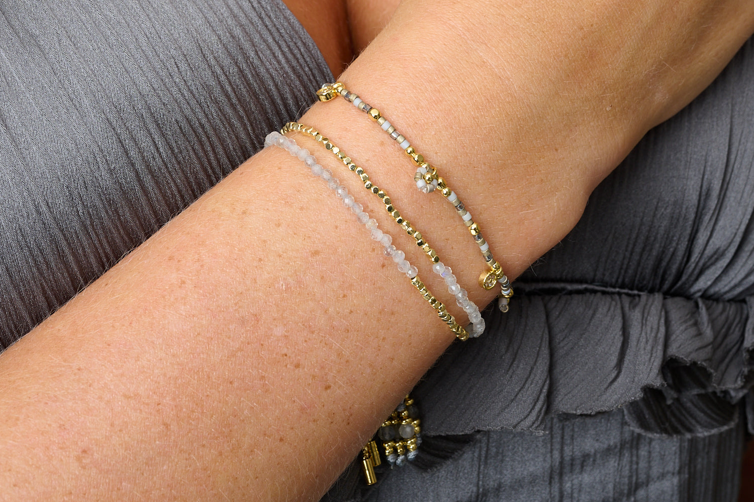 Cabras Gold & Labradorite Bracelet Stack featured on wrist with Boho Betty stacking bracelets, cool grey beads and labradorite shimmer.