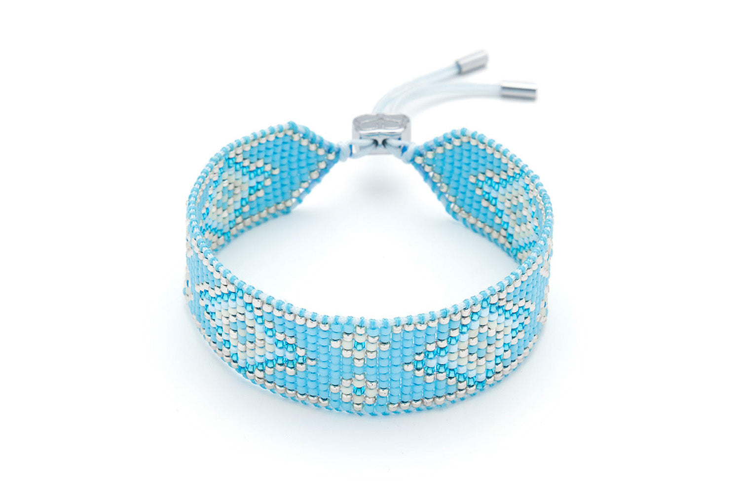 Carys Pale Blue Silver Friendship Bracelet featuring handwoven Miyuki beads in soft sky blue and silver, finished with a silver-plated adjustable slider fastening.