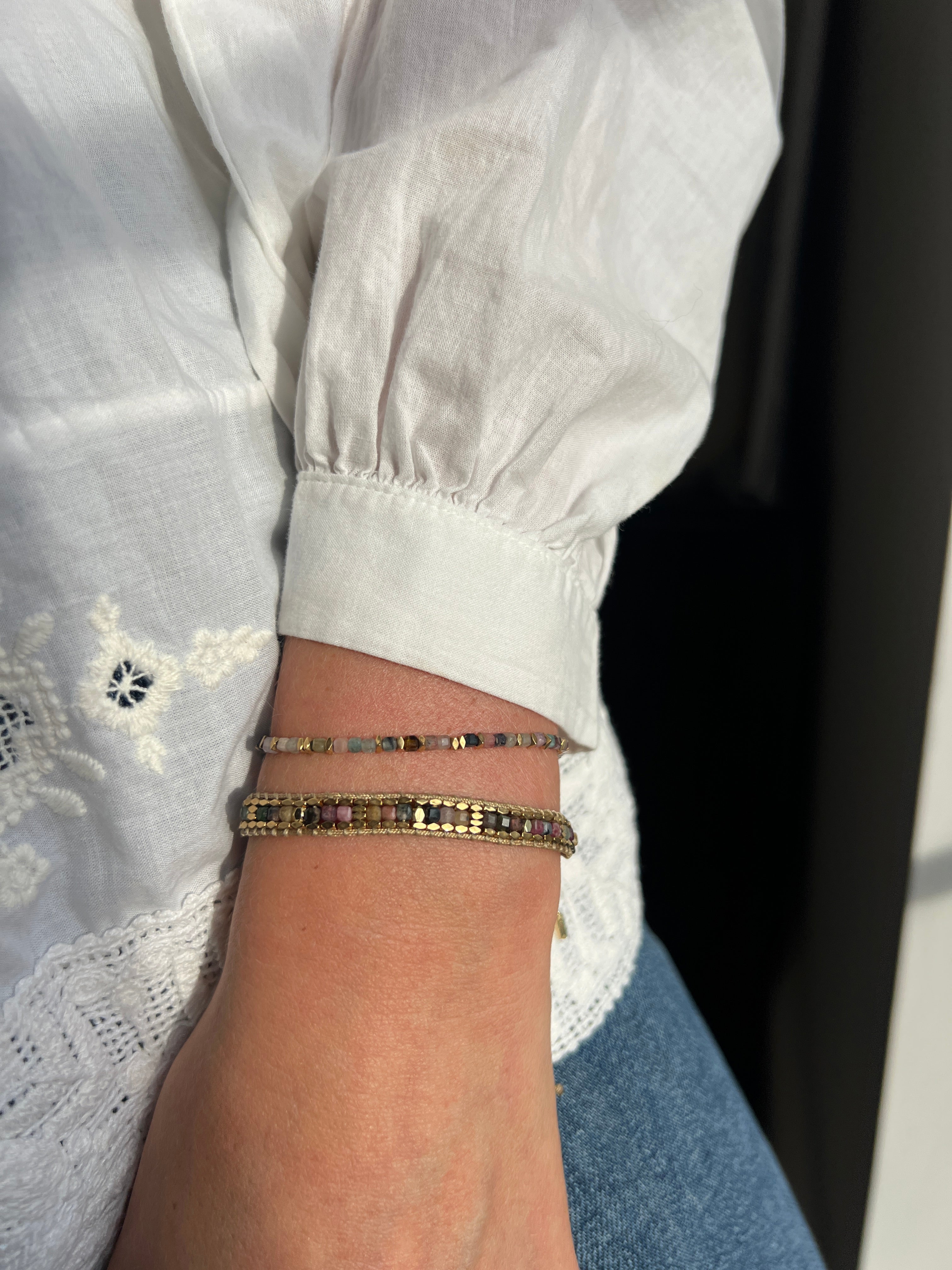 Celeste Tourmaline & Gold Bracelet Stack styled with layered jewellery in warm golden tones and earthy hues—ideal for mindful gifting or boho luxe looks.