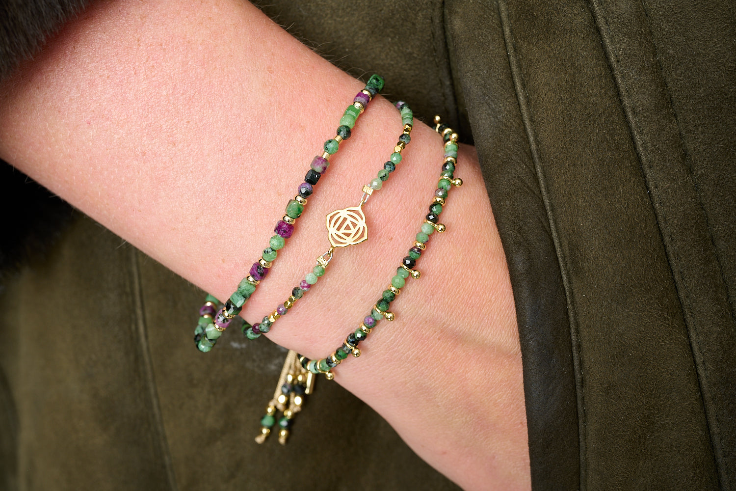 Coiba Gold & Ruby Zoisite Bracelet Stack with Violet cube-cut ruby zoisite stretch, Root Chakra strand with gold Muladhara charm, and Harmony slider with golden aura beads