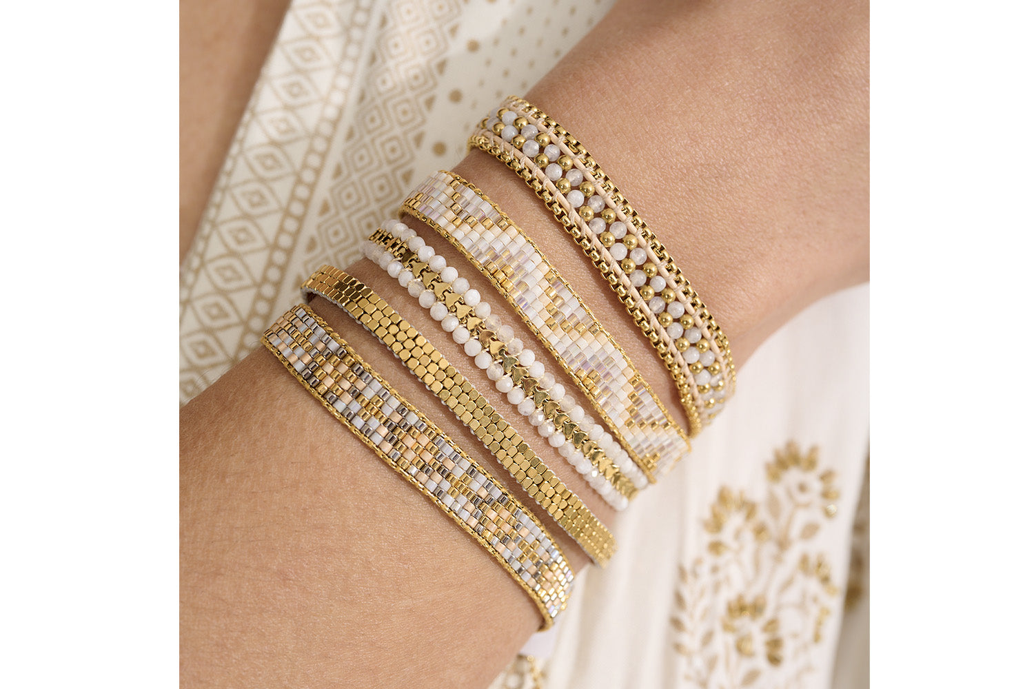 Daiko Gold Braided Bracelet styled on the wrist, catching the light with its gold beaded detailing—perfect for layering or solo wear.
