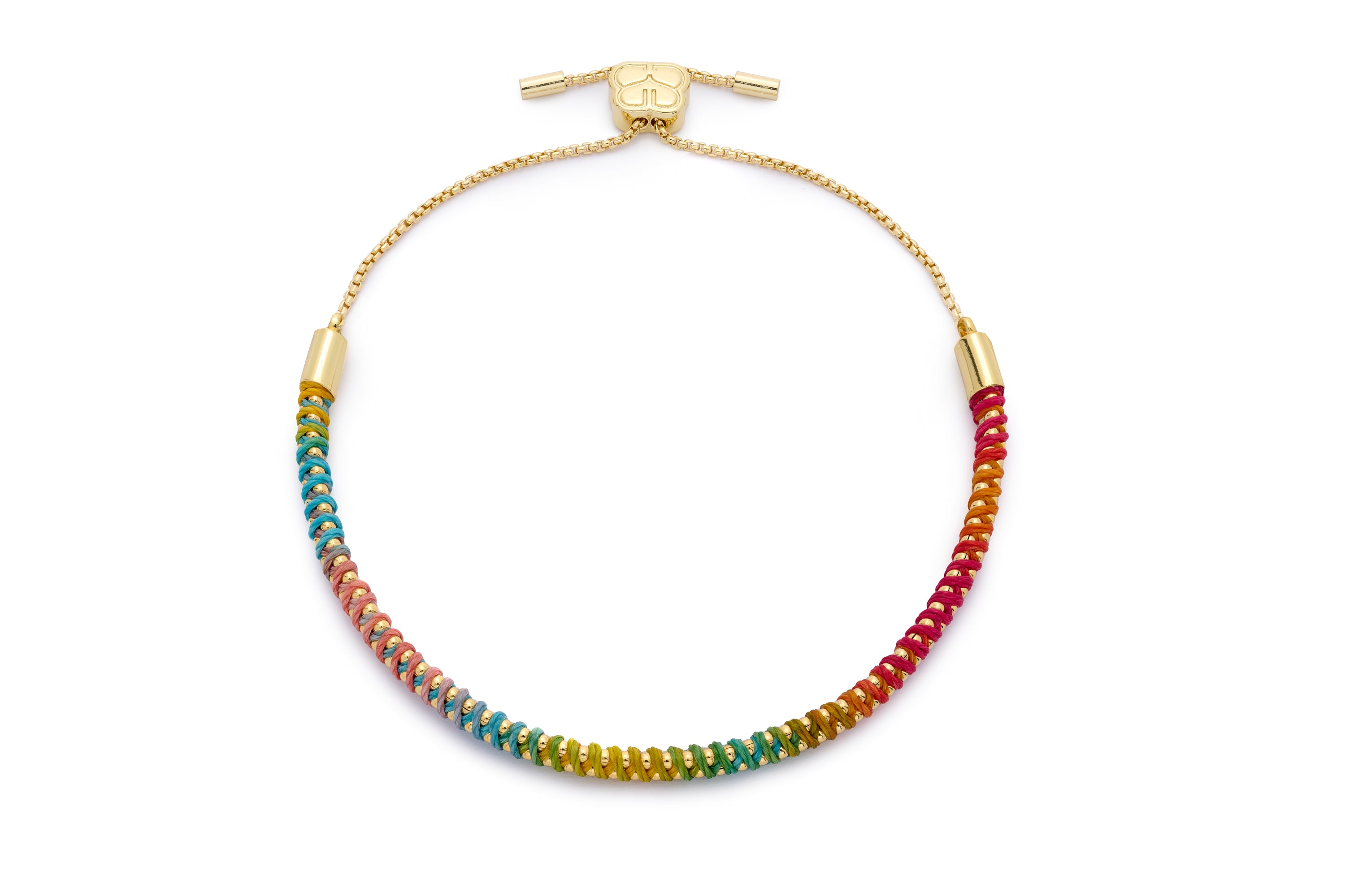 Emelia Gold Braided Rainbow Bracelet with vibrant ombré cord in rainbow colours, wrapped around a gold-plated chain and finished with a sliding adjustable fastening.