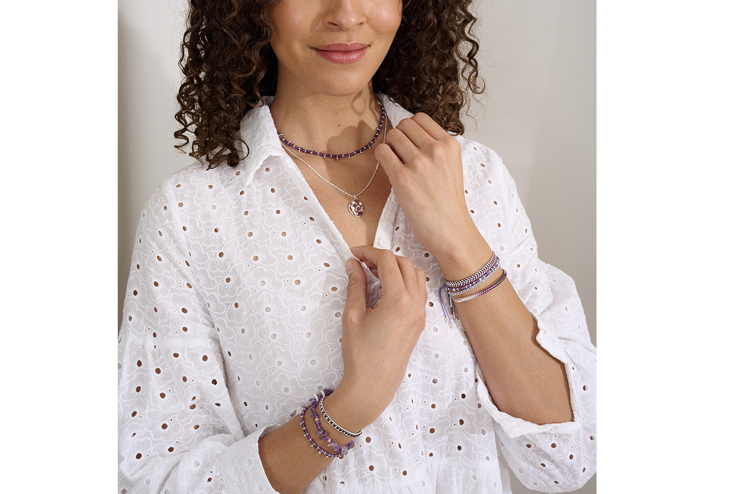 Emelia Ombre Purple Braided Bracelet styled on the wrist, showcasing the soft gradient from lilac to plum with shimmering silver chain detail—perfect for layering or wearing solo.