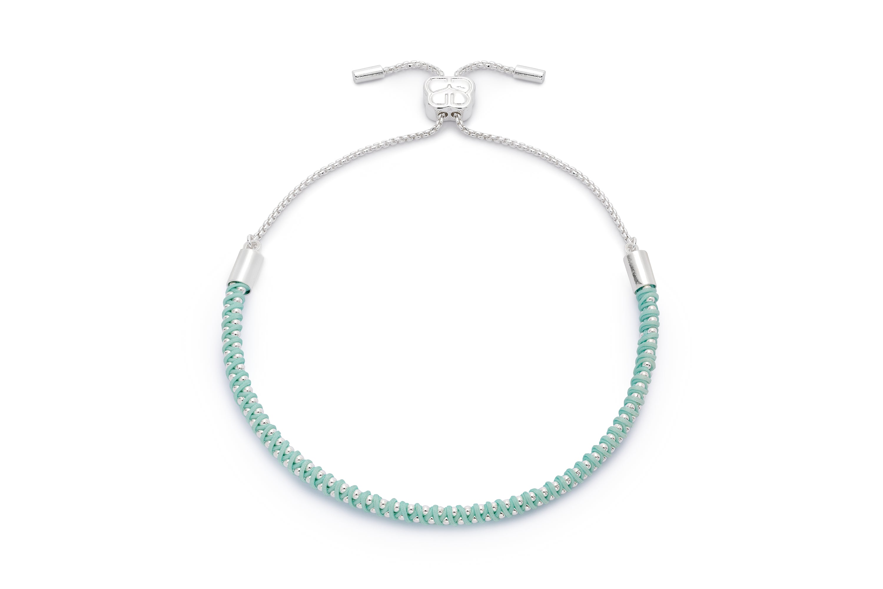 Emelia Silver & Turquoise Braided Bracelet featuring a delicate woven turquoise cord and silver chain with an adjustable slider fastening.