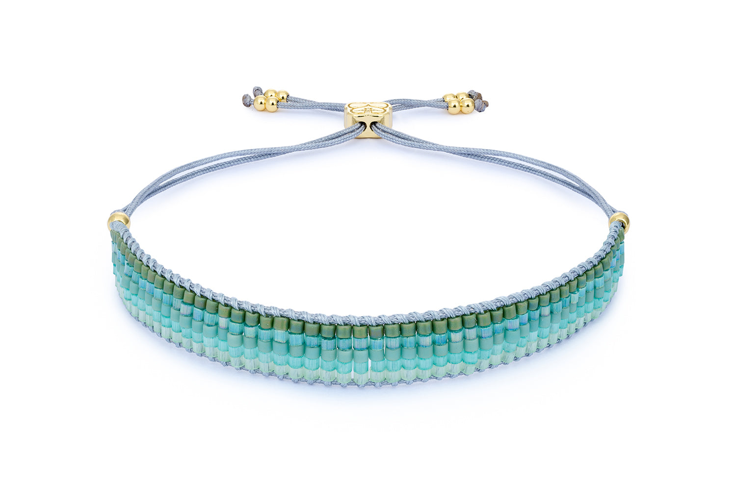 Faye Gold & Turquoise Beaded Bracelet featuring vibrant seafoam green and ocean blue Miyuki beads, accented with 12k gold-plated details and an adjustable slider fastening.