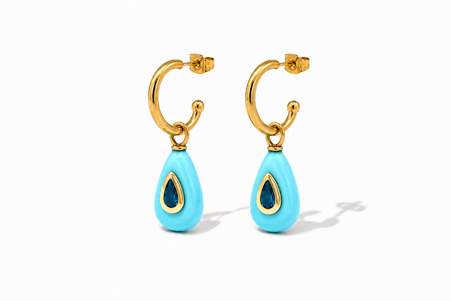 Hana Turquoise Gold Hoop Earrings featuring turquoise-coloured gemstone drops with blue crystal details on waterproof 14k gold PVD hoops.