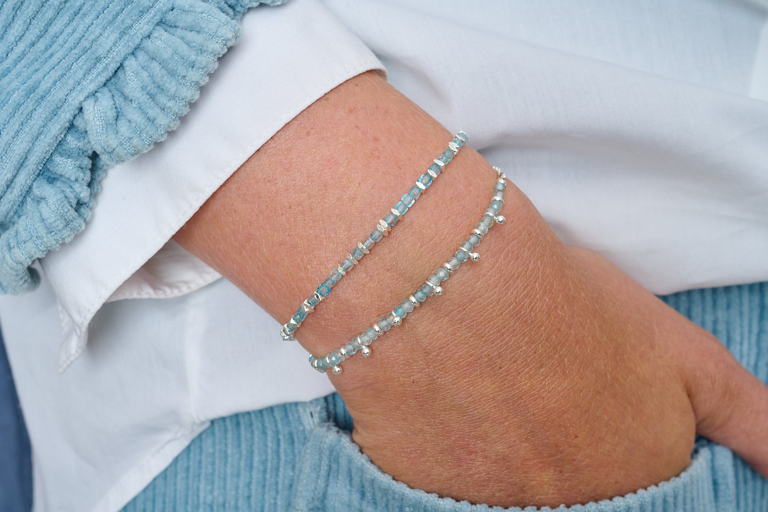 Harmony Silver & Blue Topaz Gemstone Slider Bracelet featured on wrist with Boho Betty stacking bracelets