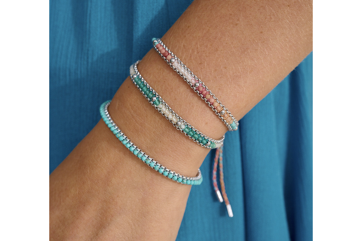 Helaine Turquoise & Silver Bracelet styled with silver bangles and earthy tones for a soft, grounding everyday look.