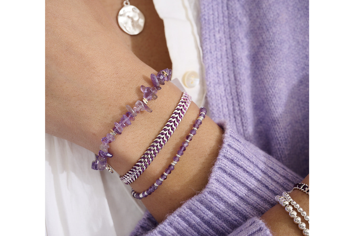 Iztac Silver & Purple Ombre Braided Bracelet styled on the wrist, highlighting the gradient purple weave and shimmering silver-plated chain.
