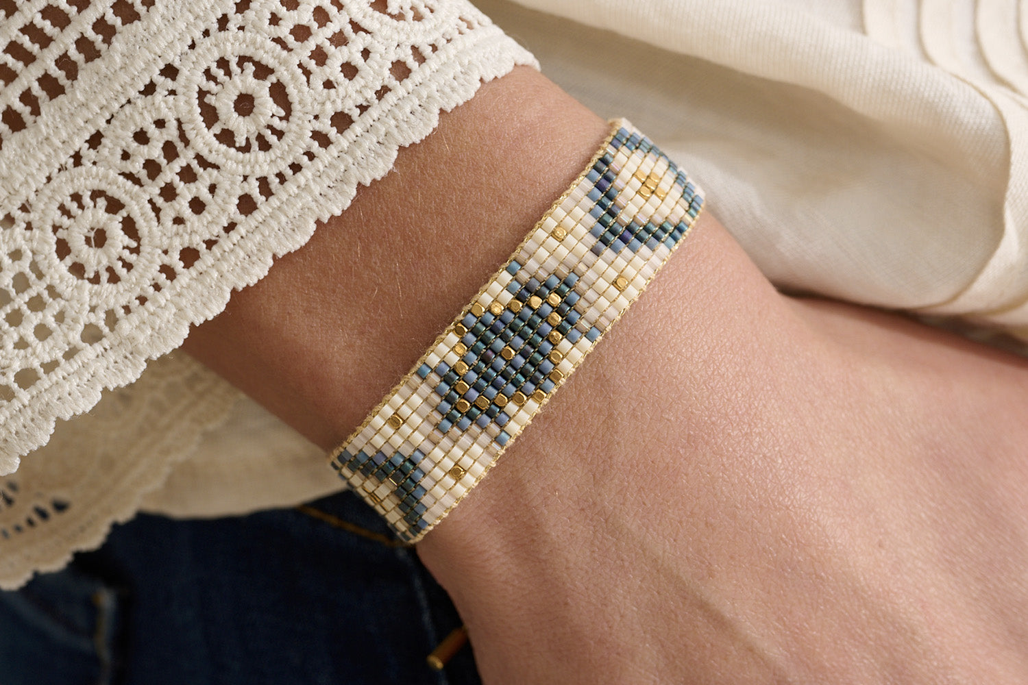 Junie Navy Gold Friendship Bracelet styled on the wrist, showcasing navy and gold hues, perfect for layering or wearing solo.