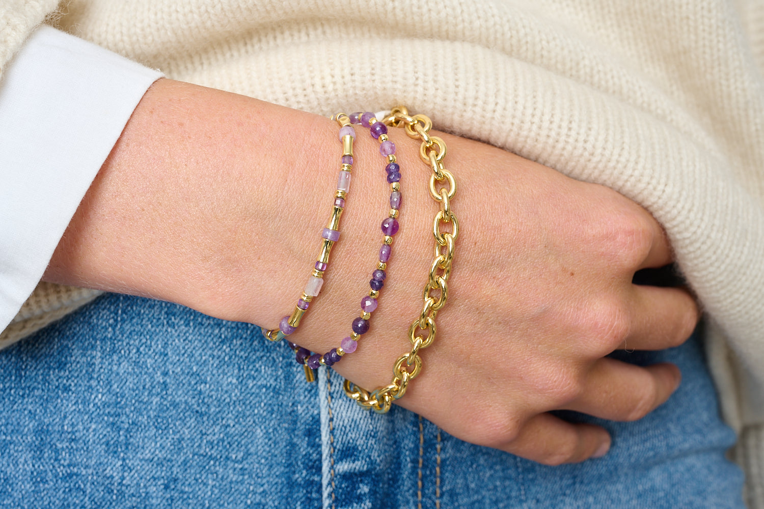 Laria Gold & Amethyst Gemstone Beaded Bracelet featured on wrist with Boho Betty stacking bracelets in gold and purple gemstone tones.