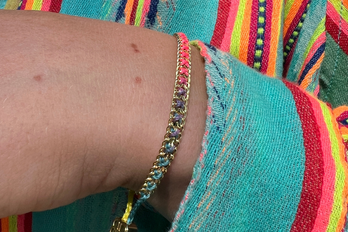 Lilia Havana Brights Gold Braided Bracelet styled on the wrist, showcasing colourful woven threads and warm 14k Gold PVD details for effortless boho layering.