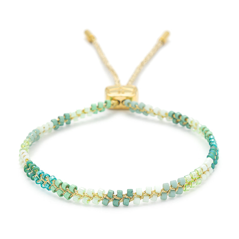 Marina Aqua Gold Braided Bracelet with aqua and green Miyuki beads, 14k gold-plated finish, inspired by ocean waves and coastal beauty.