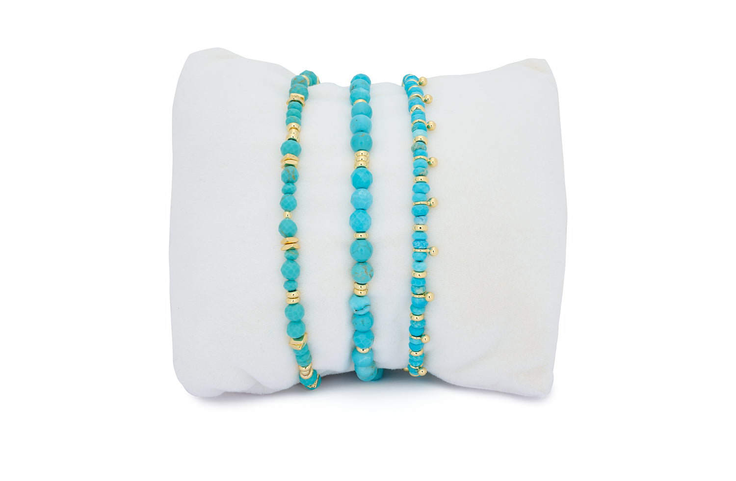 Moala Turquoise Gold Bracelet Stack featuring striking turquoise howlite gemstones and gold-plated accents in a trio of beaded bracelets.