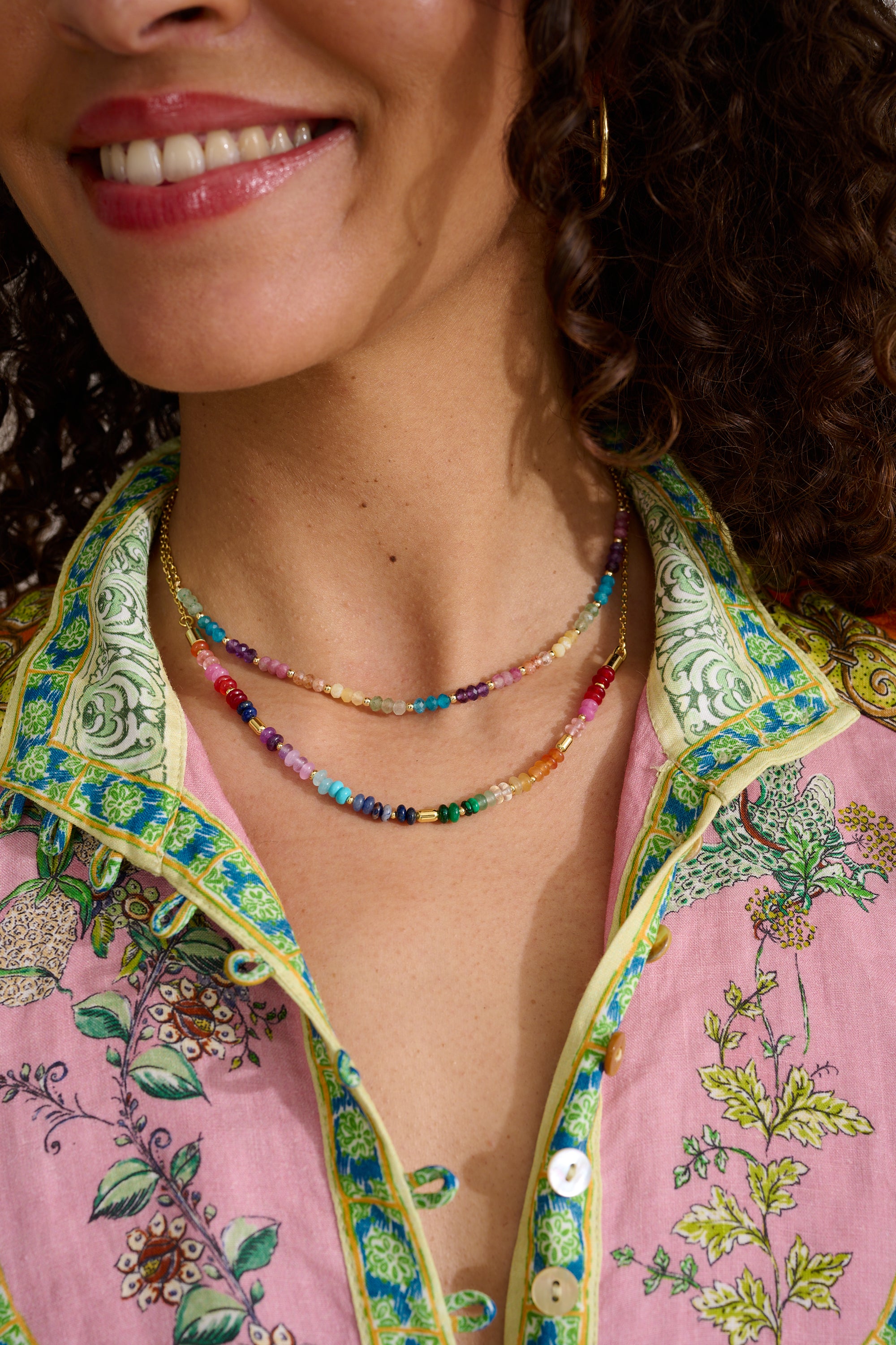 Molly Gold & Rainbow Beaded Gemstone Necklace styled for layering, showcasing vibrant rainbow gemstones and gold-plated accents—perfect for holidays or everyday wear.