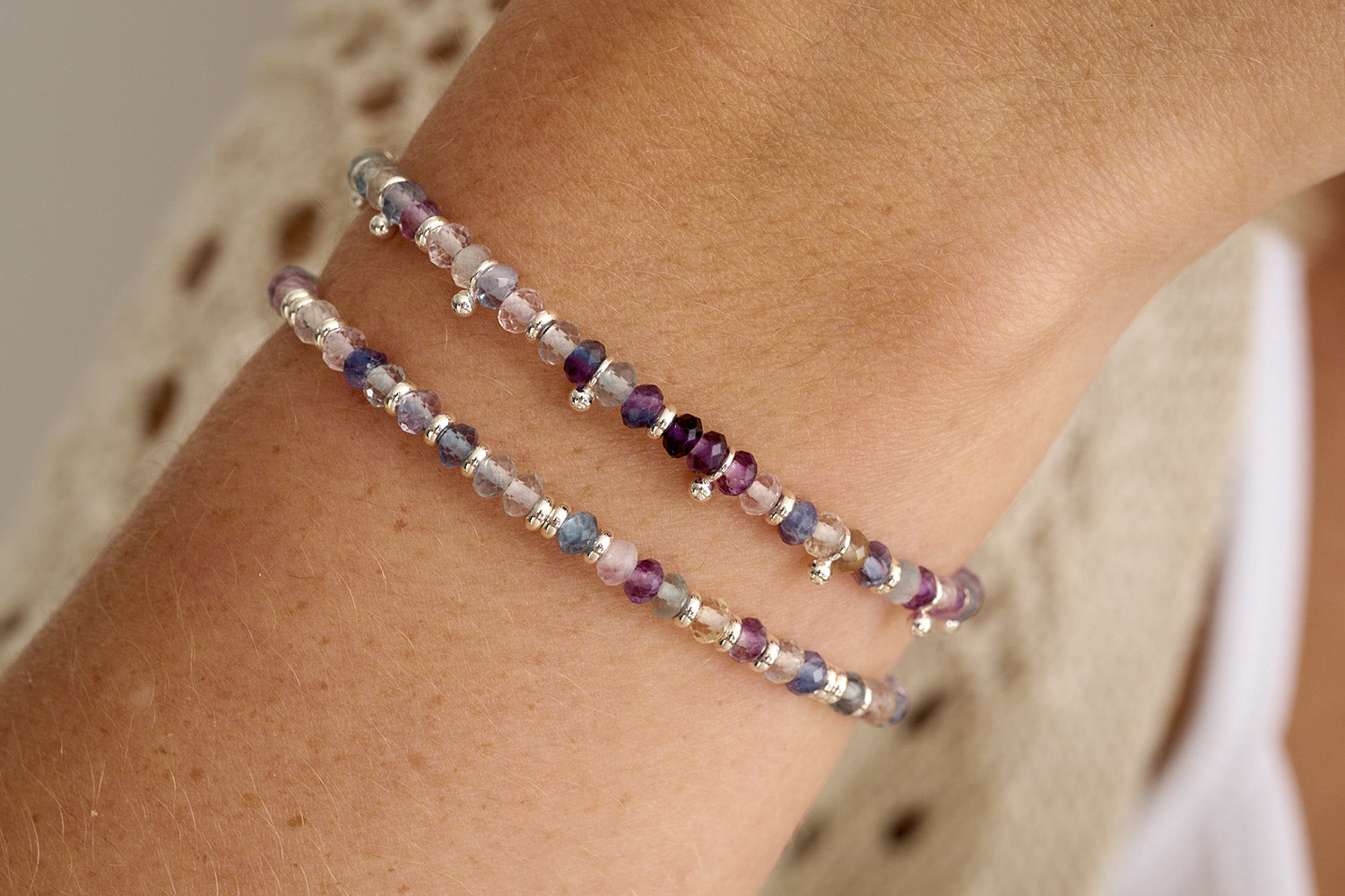Mystical Silver & Rainbow Fluorite Gemstone Bracelet styled on the wrist, showcasing its soft pastel hues, silver accents, and effortlessly chic boho-luxe design.