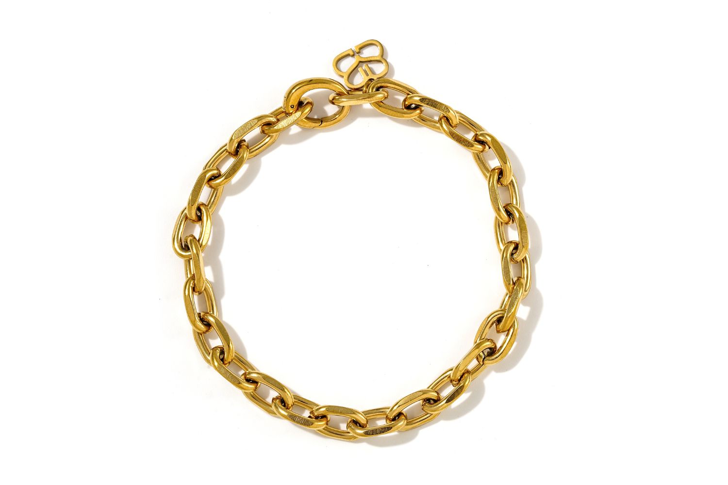 Nyssa Chunky Oval Gold Chain Bracelet with polished interlocking links and a sleek high-shine finish.