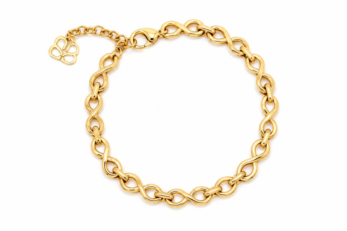 Octavia Gold Infinity Link Bracelet featuring polished gold infinity chain links, a waterproof 14k Gold PVD stainless steel finish and an adjustable lobster clasp fastening.