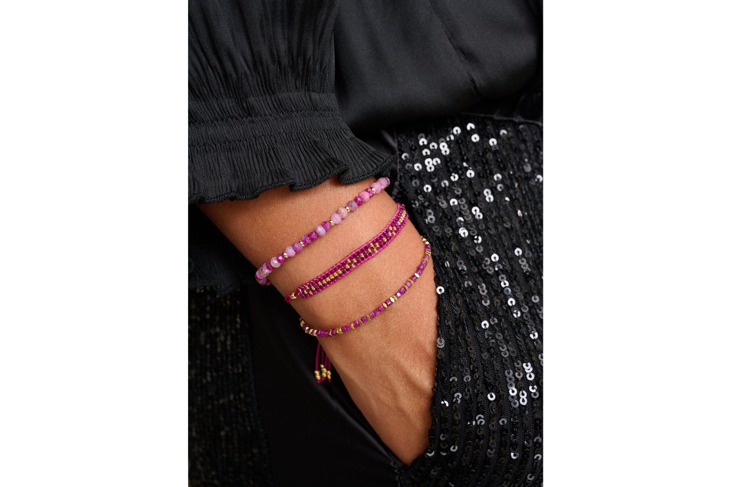 Rue Gold & Ruby Bead Bracelet styled on a wrist, showing its soft, romantic ruby beads and gold accents, perfect for layering or gifting as a July birthstone bracelet.