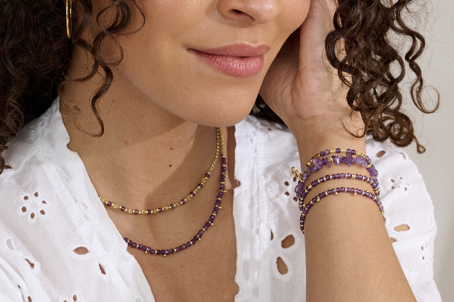 Sana Gold & Amethyst Crystal Stretch Bracelet styled on the wrist, showcasing deep violet gemstone chips, gold accents, and a boho-luxe aesthetic—perfect for stacking.