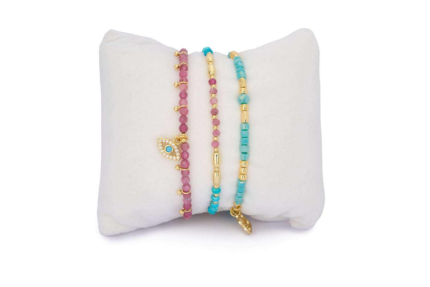 Santa Cruz Turquoise & Pink Tourmaline Gold Bracelet Stack featuring three layered gold-plated gemstone bracelets with turquoise, pink tourmaline, and an evil eye charm.