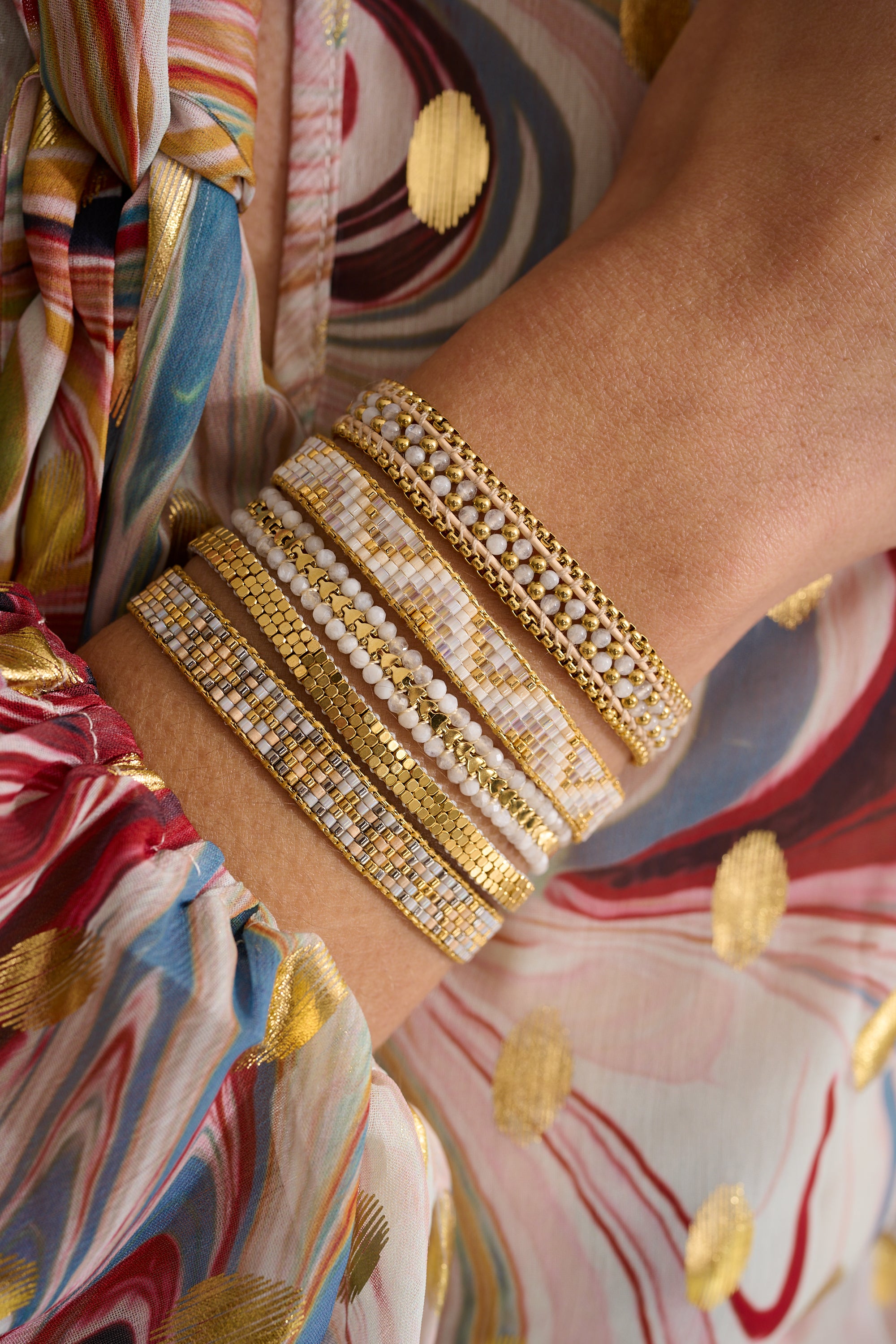 Saskia Taupe Gold Friendship Bracelet styled on the wrist, featuring a neutral palette of taupe and gold, perfect for layering or wearing solo.