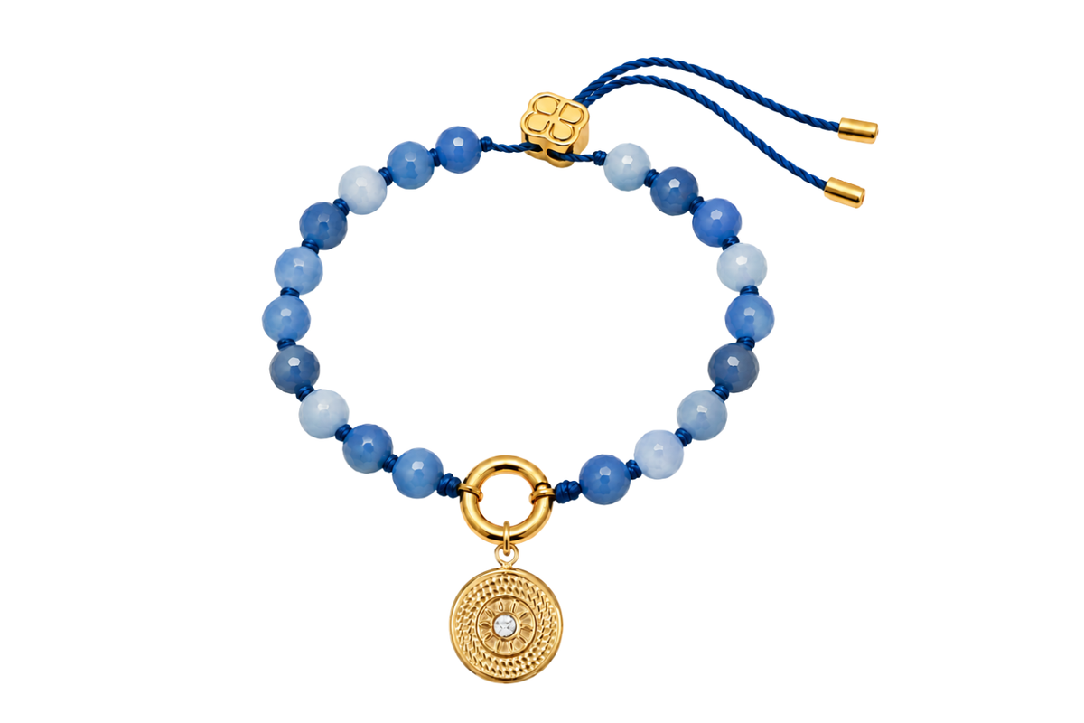 Soraya blue aventurine gold charm carrier bracelet finished with the gold Lucia sun compass charm, a waterproof Boho Betty gemstone bracelet.
