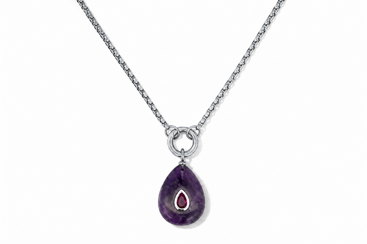 Thalia Long Amethyst Teardrop Pendant Necklace featuring a natural amethyst gemstone with a ruby-coloured crystal on a waterproof stainless steel chain.