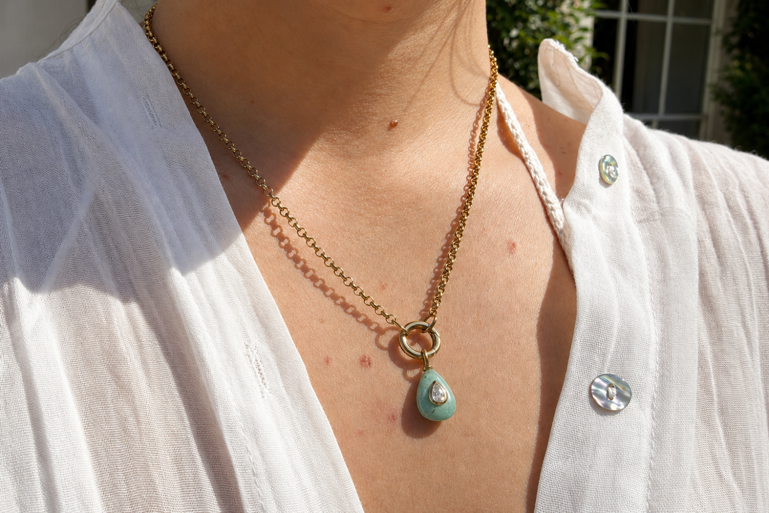 Thalia Short Amazonite Teardrop Pendant Necklace worn layered on the neckline with an amazonite pendant and waterproof 14k gold PVD chain.