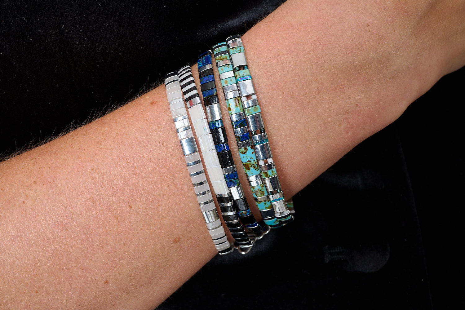 Think Silver, Black & White Tila Bracelet styled with monochrome striped beads in a bold boho bracelet stack.