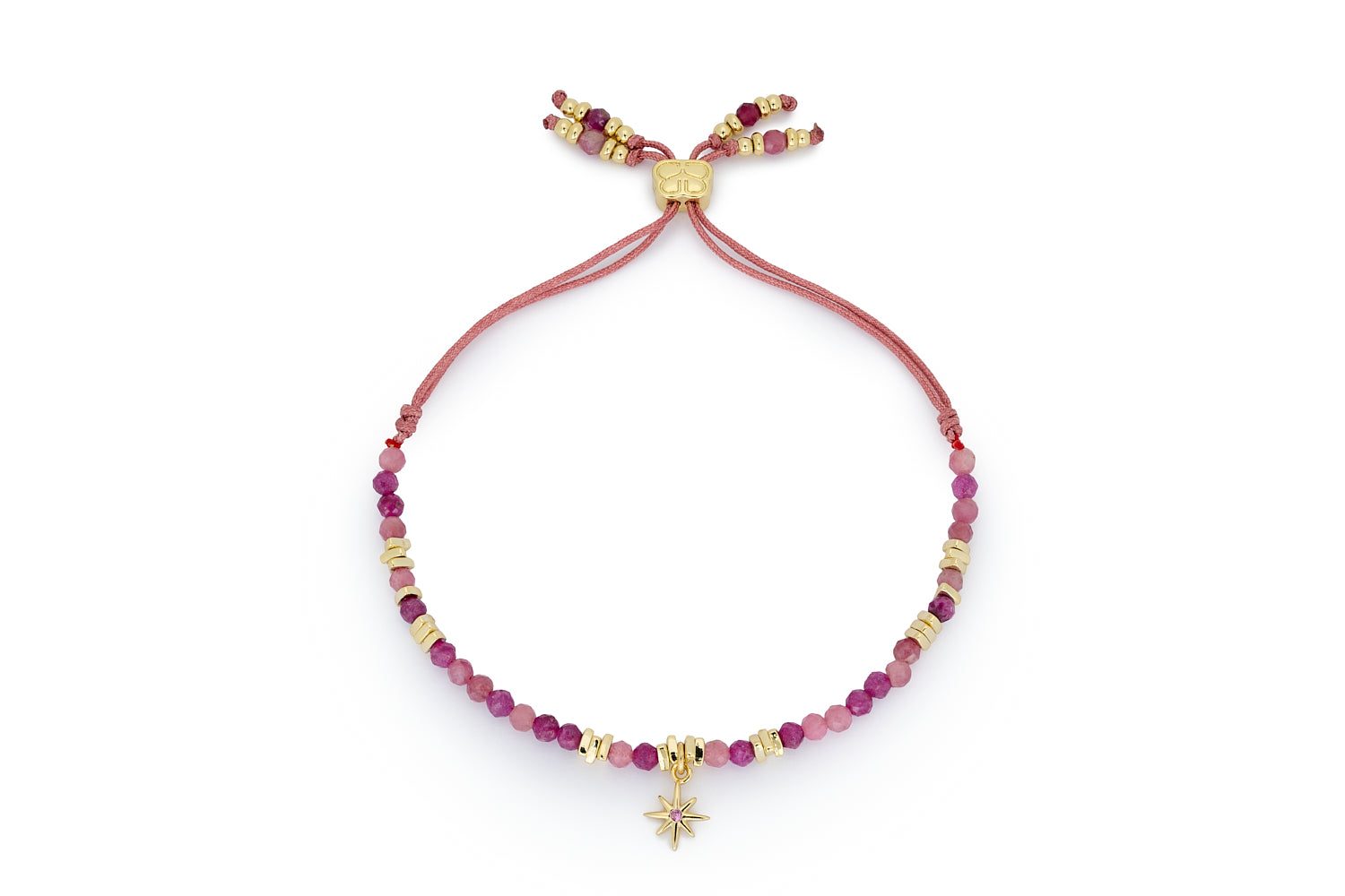 Una Ruby Mix Gold Star Charm Bracelet featuring ruby gemstone beads, a gold star charm with a pink crystal centre, and a gold-plated adjustable thread slider.