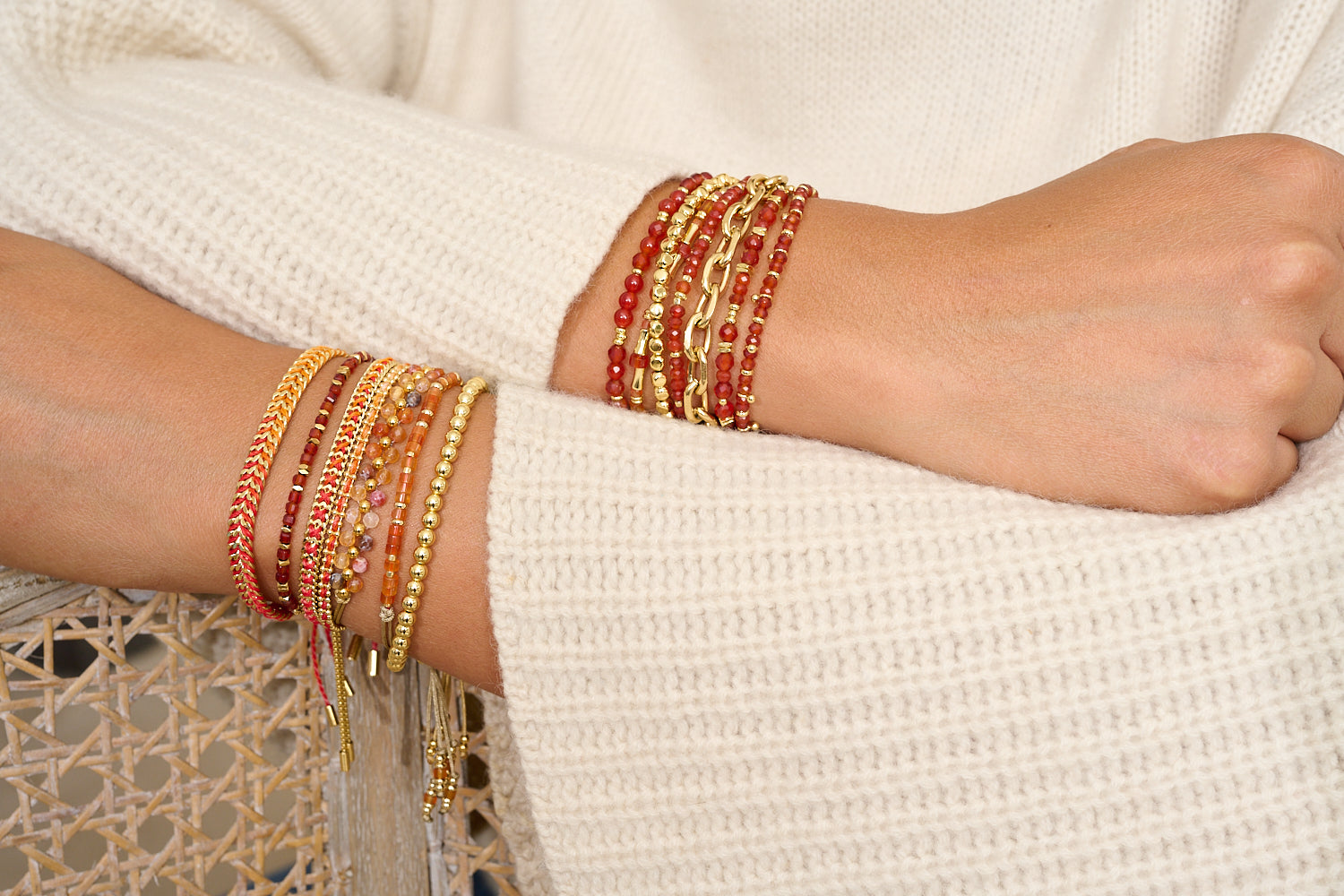 Valentina Gold & Red Agate Gemstone Bracelet styled on a wrist, showcasing vibrant red gemstones, dainty gold beads, and adjustable chain detail for easy boho-luxe stacking.