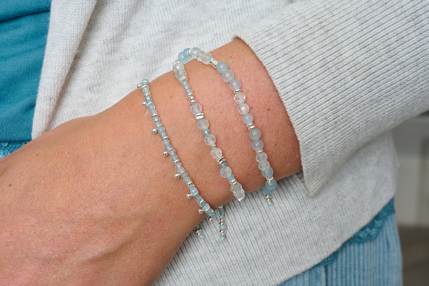 Wonder Silver & Blue Topaz Stretch Bead Bracelet featured on wrist with Boho Betty stacking bracelets