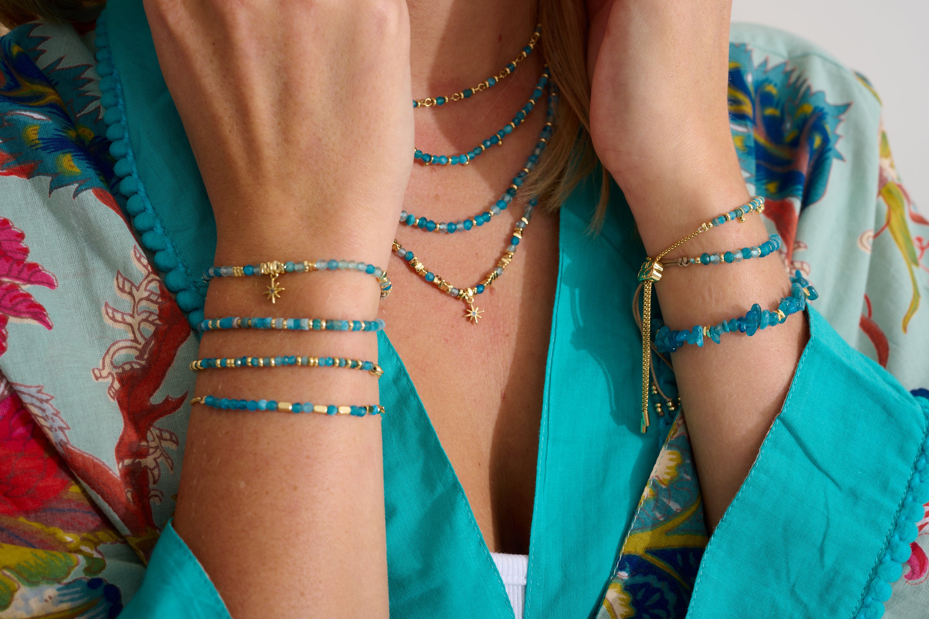 Yolanda Apatite & Gold Star Charm Necklace featuring deep ocean blue Apatite gemstones, gold-plated accents, and a twinkling star charm with a crystal centre.