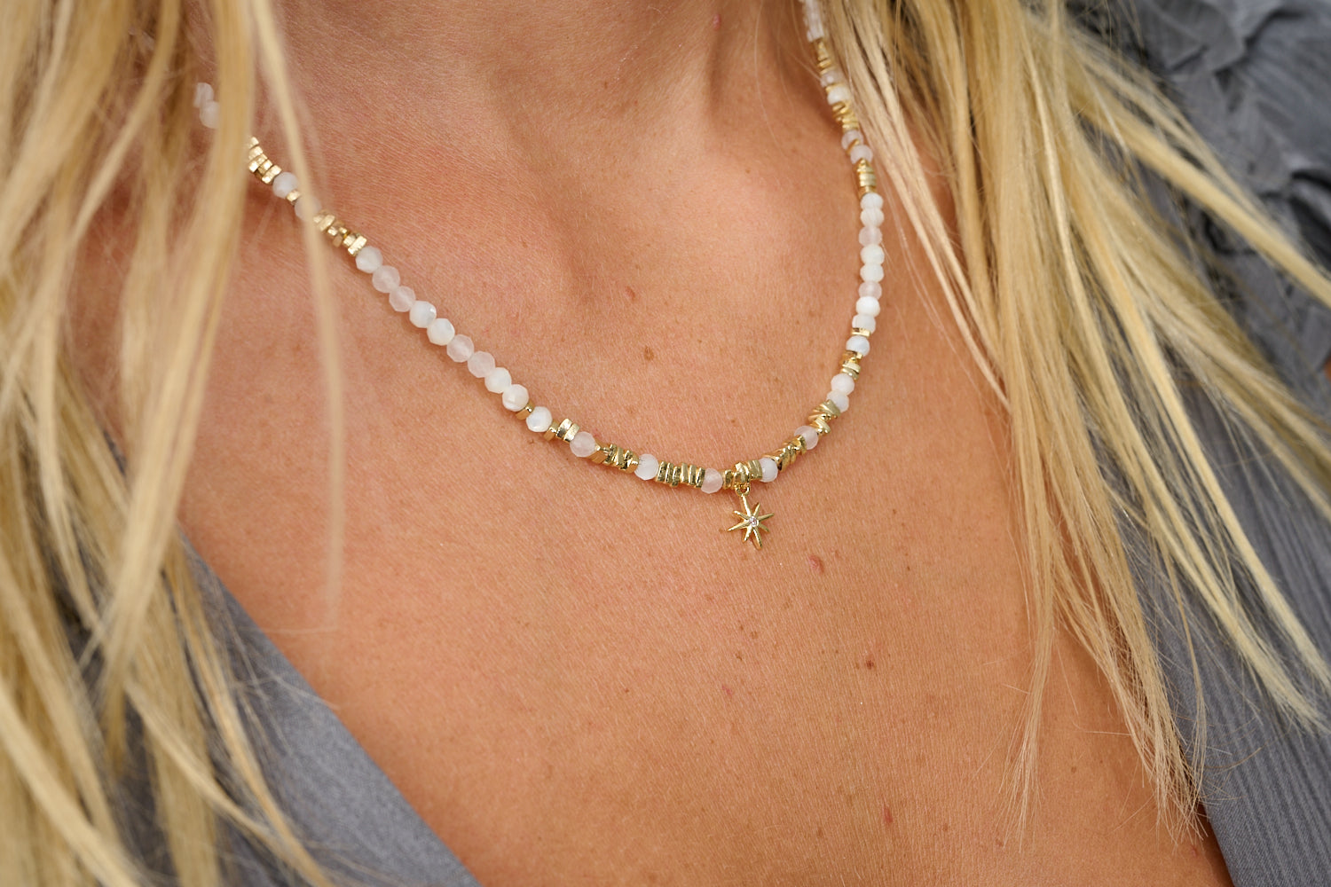 Yolanda gold pearl and moonstone necklace featured on neckline with Boho Betty stacking necklaces