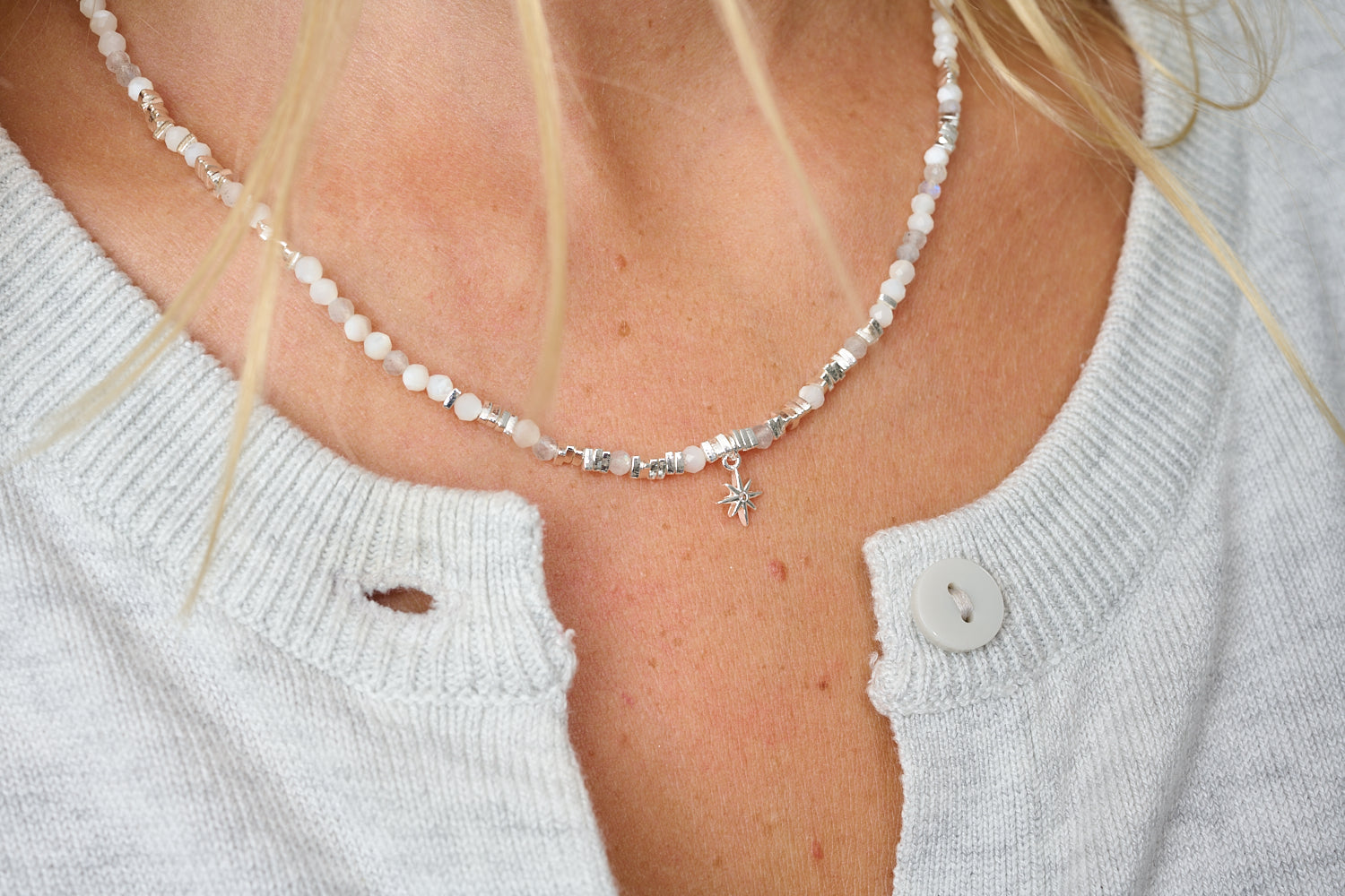 Yolanda silver rainbow moonstone necklace featured on neckline with Boho Betty jewellery layering