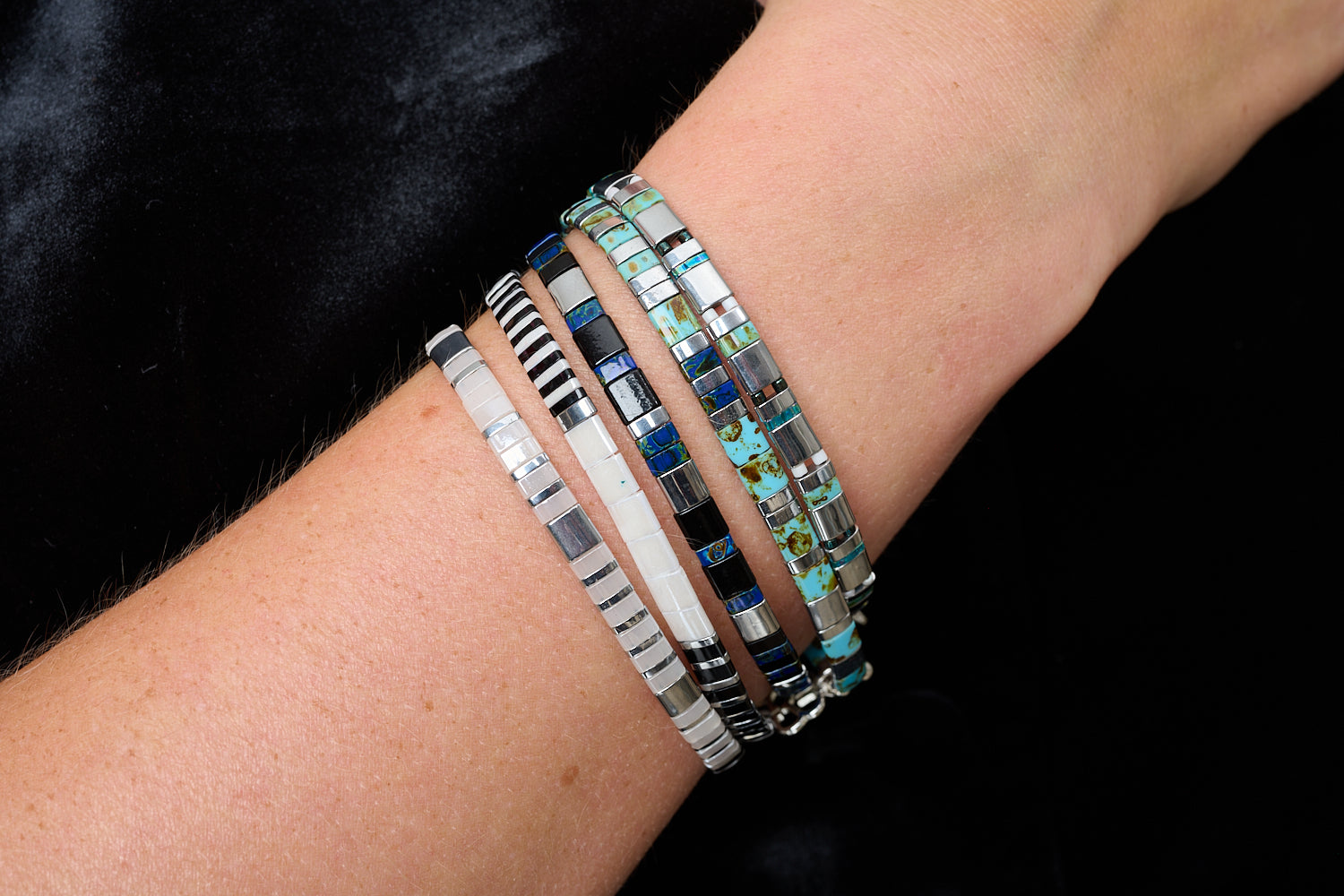 Zoom Silver & Blue Tila Bracelet styled with silver, turquoise and navy striped beads in a boho bracelet stack.