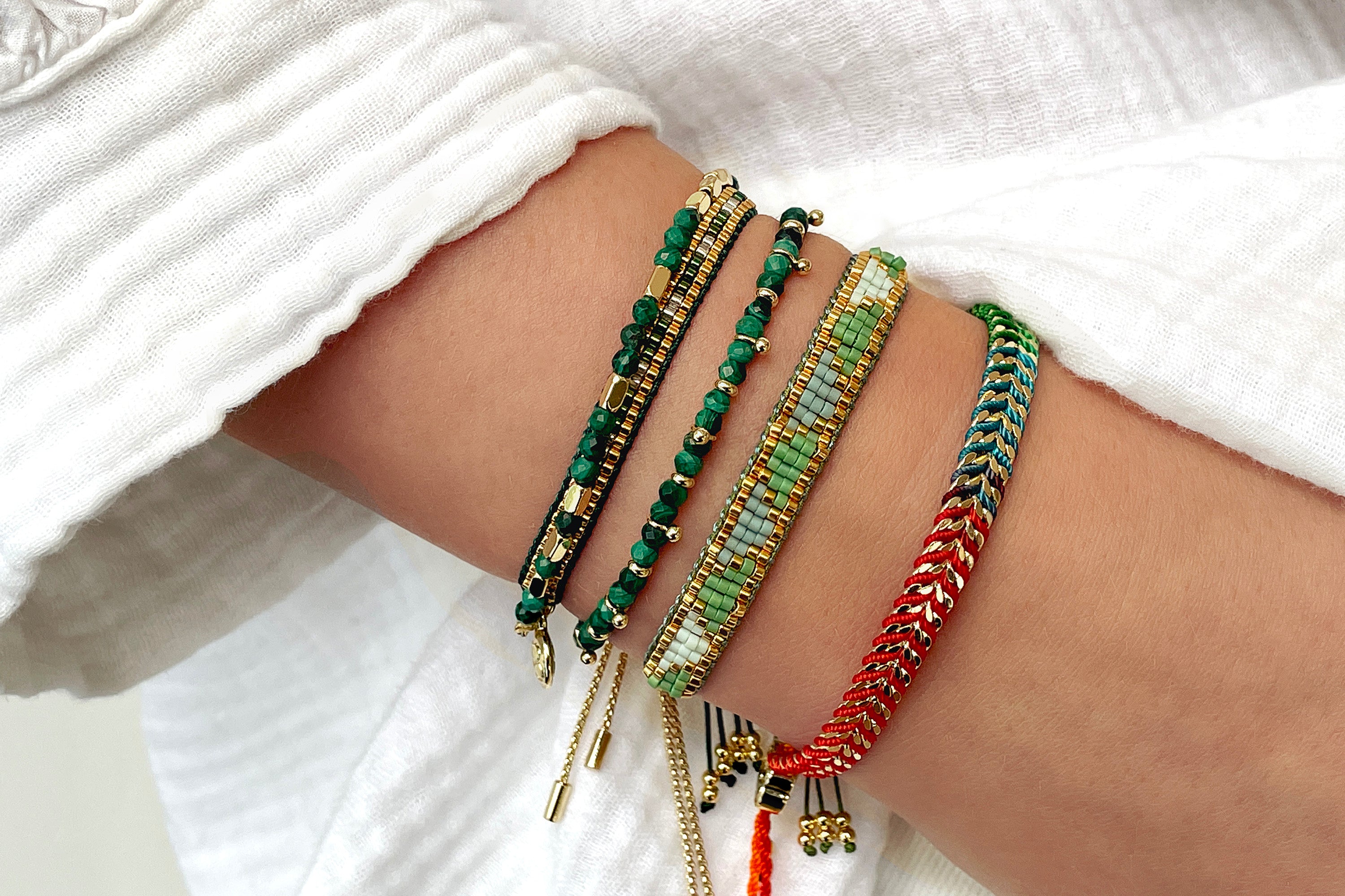 Create a unique stack with the Malachite Gemstones, mixing with the Venus POint Green Gold and the Iztac Rainbow Gold.