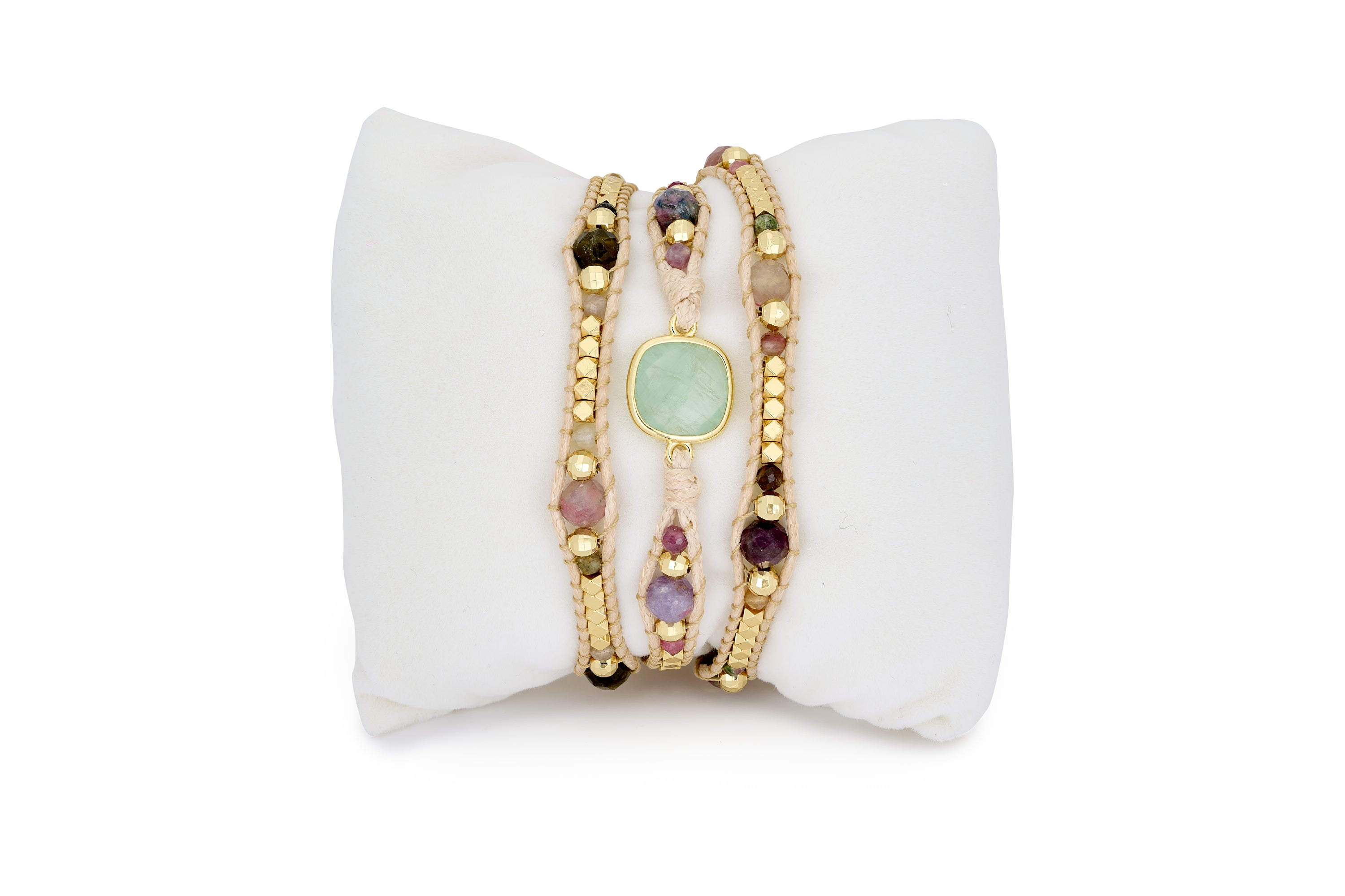 Discover the dreamy America Wrap Tourmaline Bracelet. Handmade with pastel tourmaline, Green Fluorite, gold-plated hematite, and a tan wax cord, this bracelet is perfect for layering and gifting.