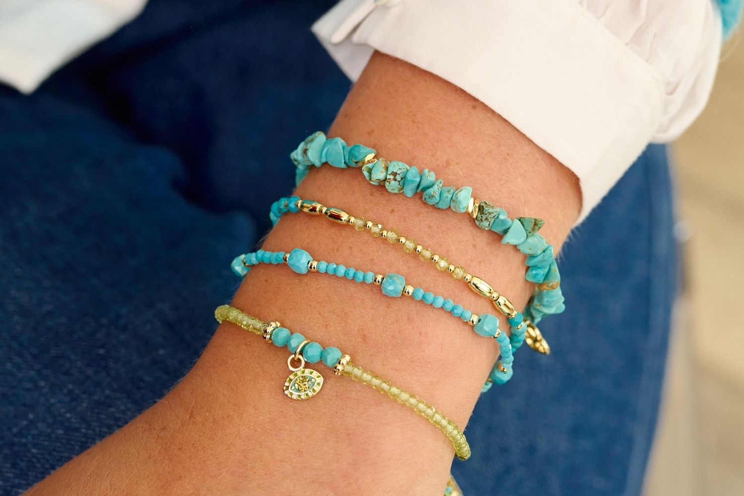 Boho Betty Peridot and Turquoise Bisbee Bracelet stacked for a statement look with Treasure and Sana.